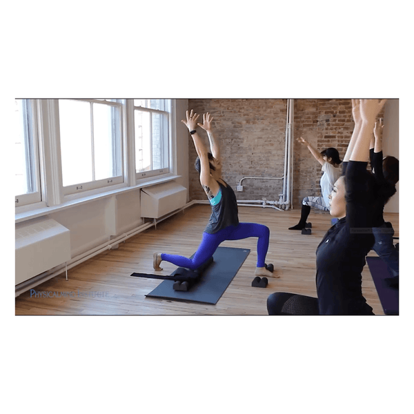 Parasetter® from physicalmind institute pilates gentle yoga video clip featuring female yoga instructor teaching a gentle yoga class to yoga students using a yoga mat and parasetter® with parasetter® accessories