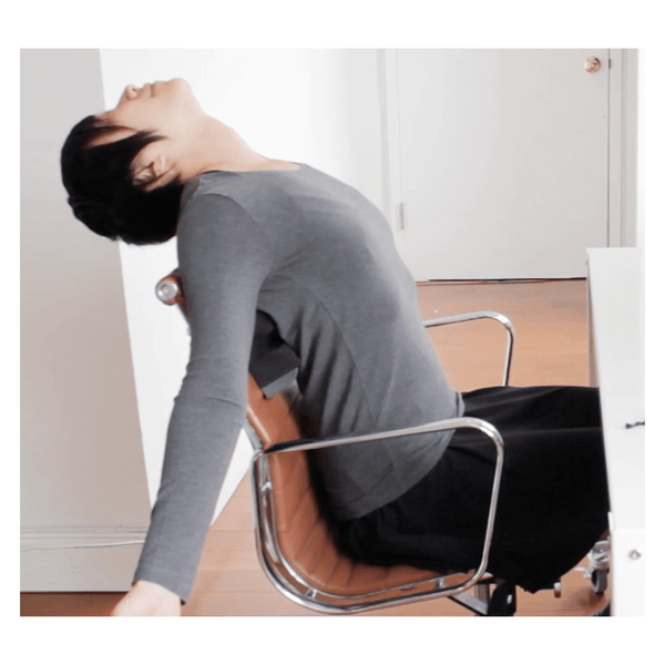 MINIs™ Lean by physicalmind institute modeled by a female model demonstrating leaning back in an office chair as a work from home or in office worker